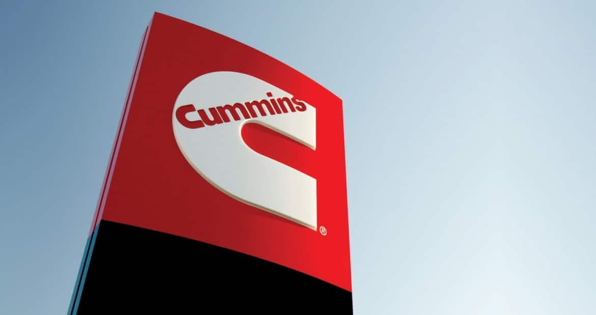 A Cummins sign against a blue sky, representing the company's strong presence in the industry.