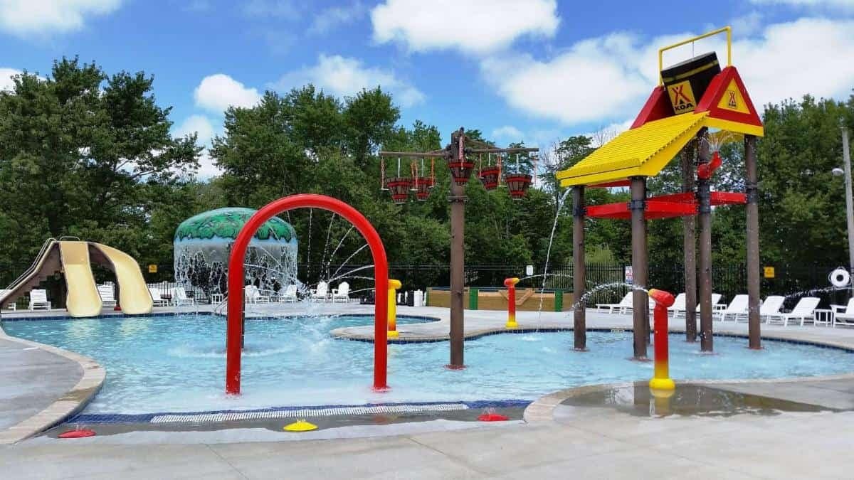 A water park with a slide and playground equipment, located at the Indianapolis KOA Holiday, named Campground Of The Year.