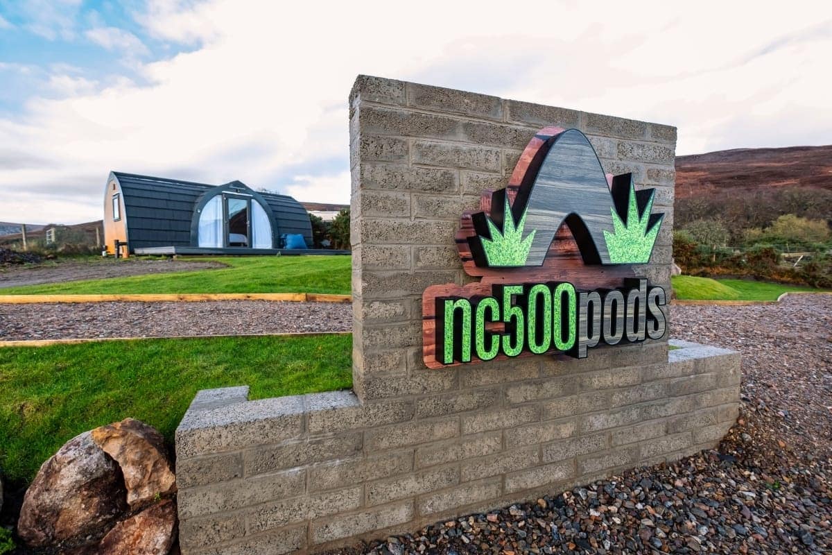 A sign that says nc50 pods in front of a house.