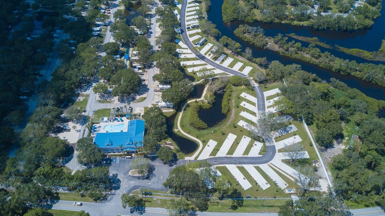 An aerial view of Bay Bayou RV Resort, a recipient of the Best Park Award by the Florida RV Park and Campground Association, located near a river.