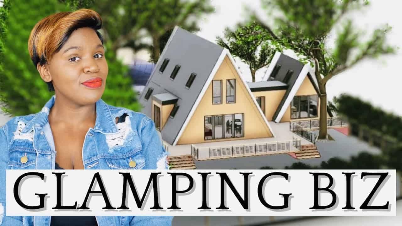A woman standing in front of a glamping tent.