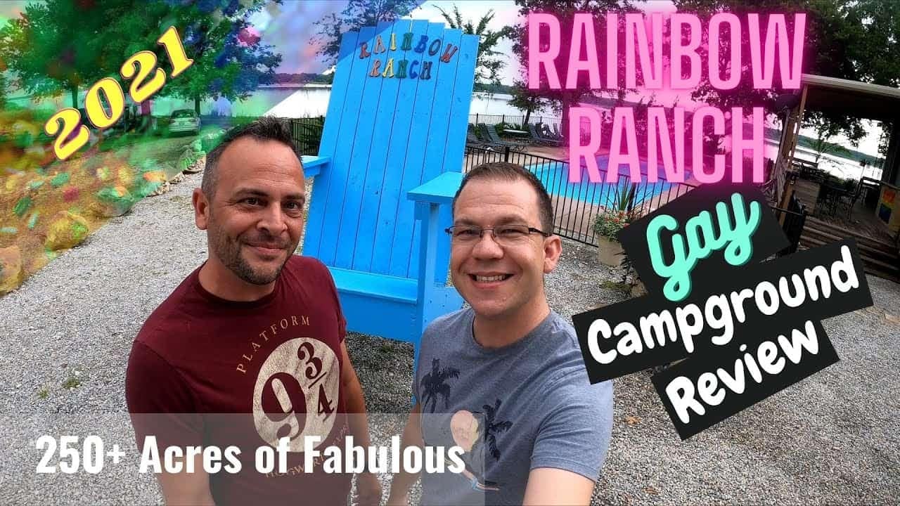Two men standing in front of a blue chair at the Rainbow Ranch LGBT Campground, receiving fabulous reviews.