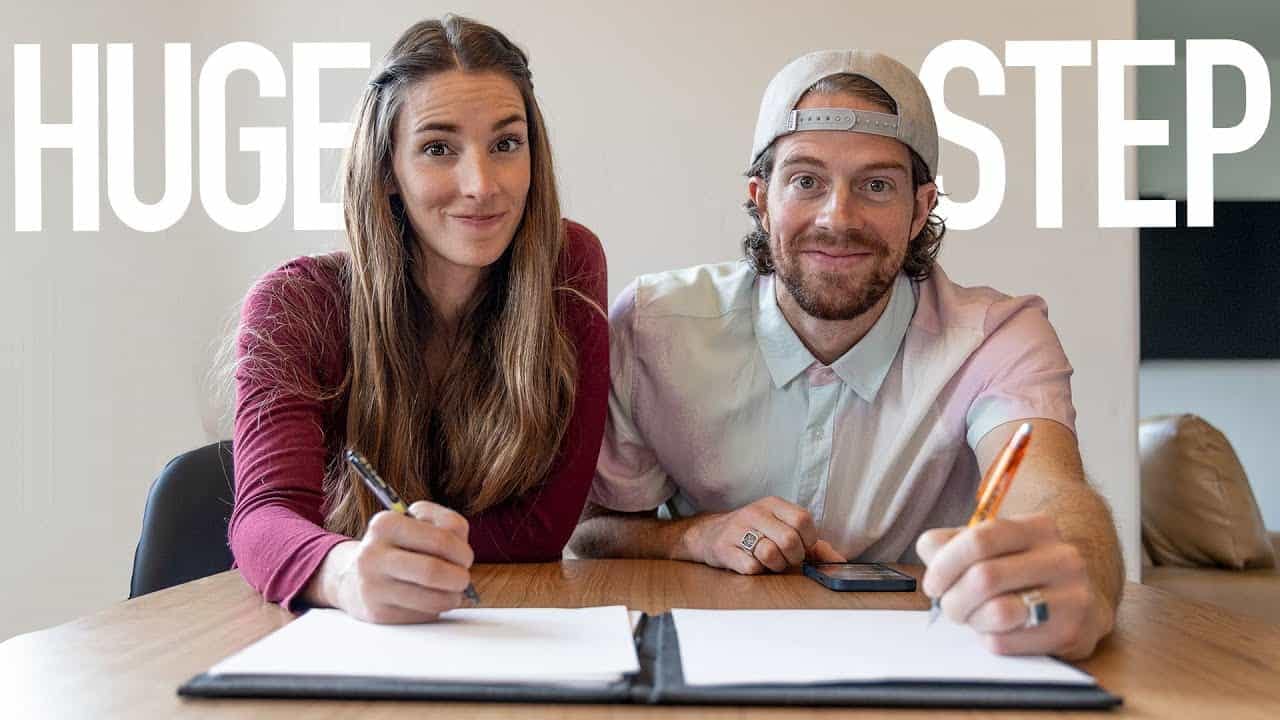 Two people sitting at a table discussing a huge step offer.