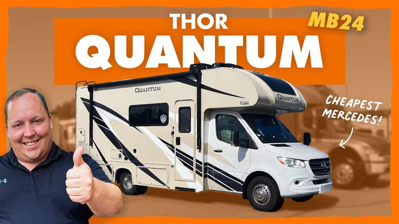 A man is giving a thumbs up to an RV with the text "Thor Quantum," the cheapest option available.
