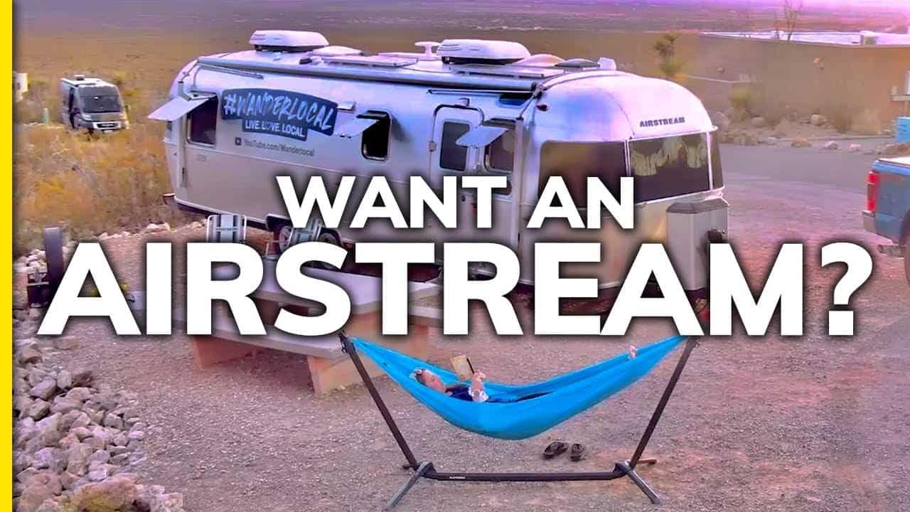 Looking to buy a 2022 Airstream trailer? Check out this sleek airstream with the words "want an airstream?" boldly displayed.