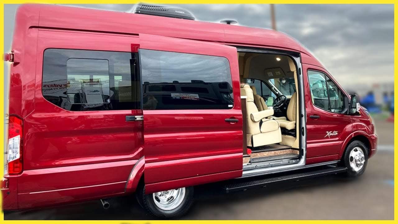 A Ford Transit camper van with the door open.