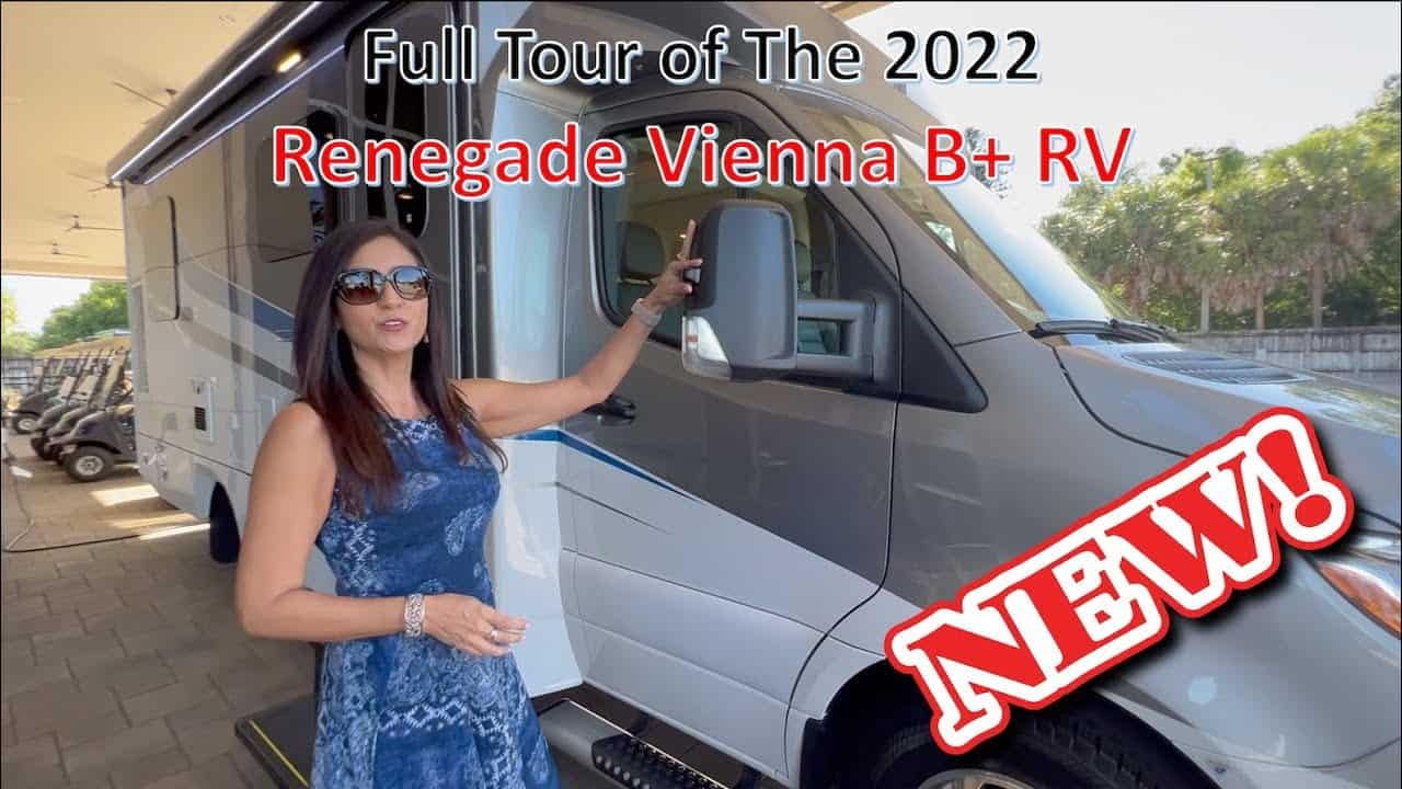 A woman posing in front of an RV with the words fall tour of the 2022 Renegade Vienna.