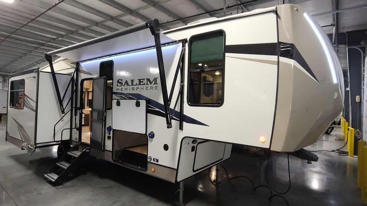 The 2022 Salem Hemisphere 286RL, an impressive and spacious RV, is parked in a warehouse.