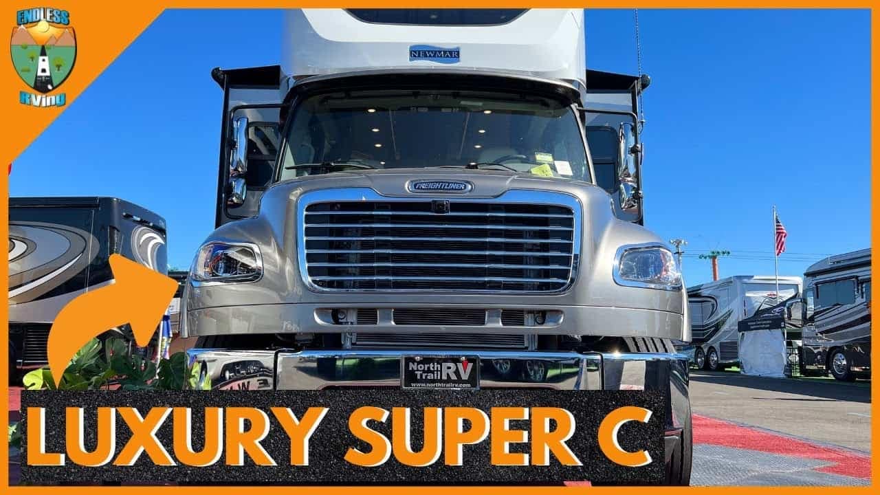 A luxurious silver truck featuring the words "Luxury Super C" on it.