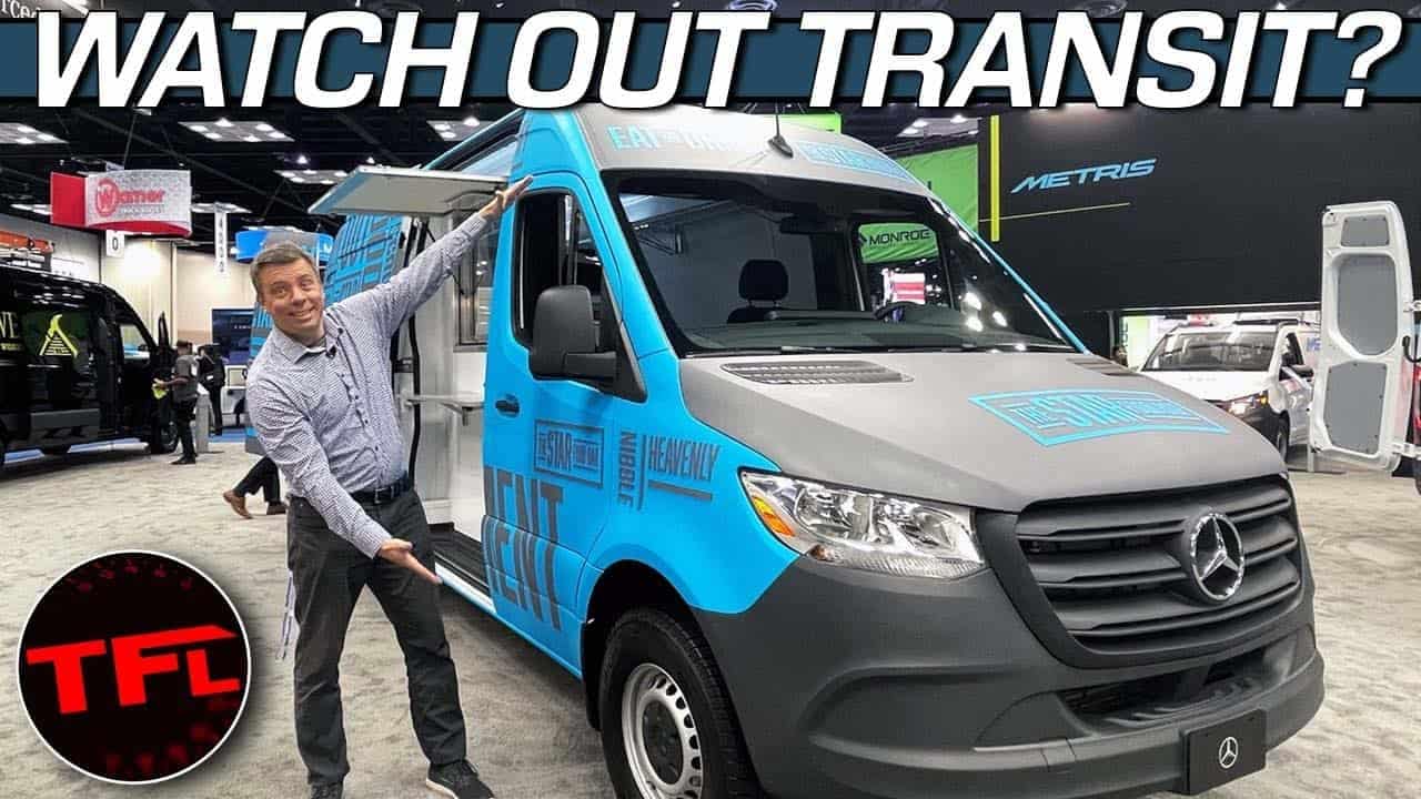 A man is standing next to a 2023 Mercedes Sprinter van.