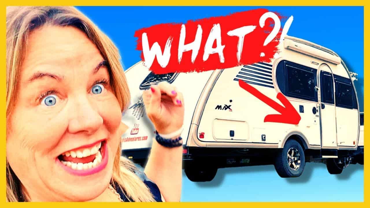 A woman is standing next to a 2022 Little Guy Max Tour rv with the words what?