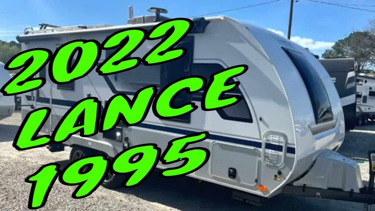 The 2022 Lance 1995 Travel Trailer is parked in a lot.