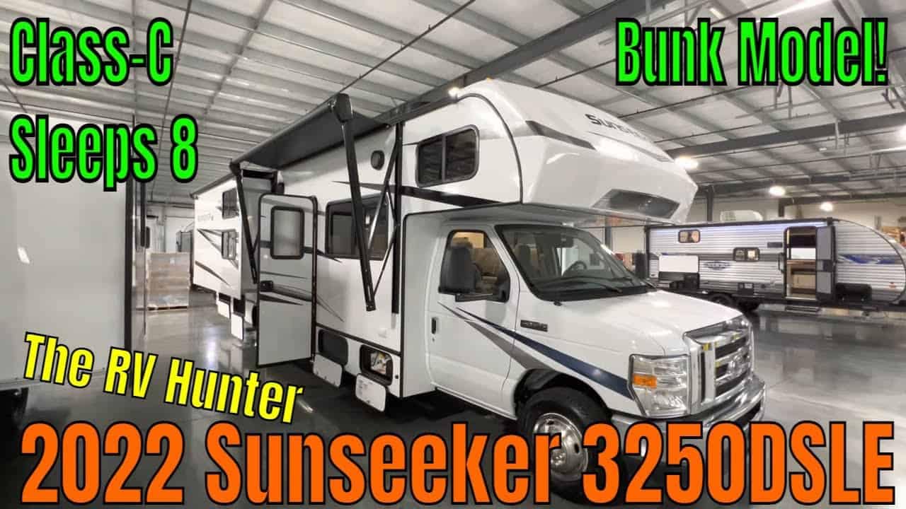 The 2022 Sunseeker 3250DSLE RV Tour is parked in a garage.