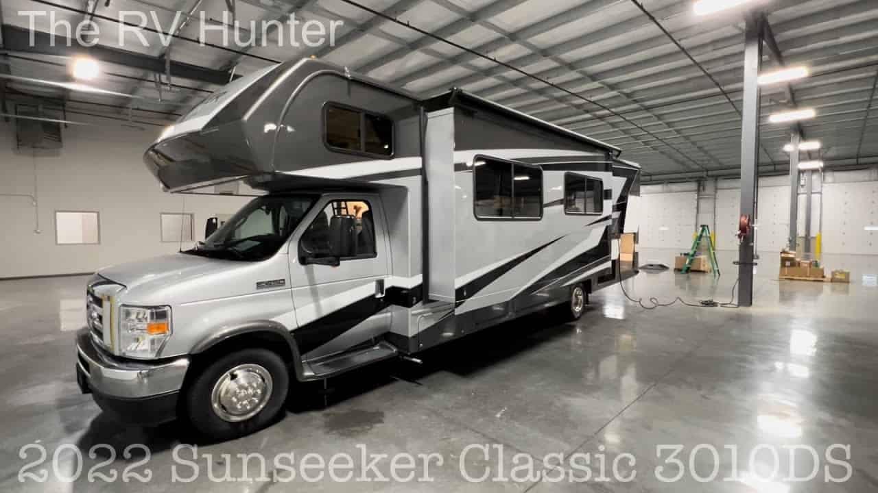The RV Hunter offers a captivating RV Tour of the 2022 Sunseeker Classic 3010DS, showcased within a spacious garage.