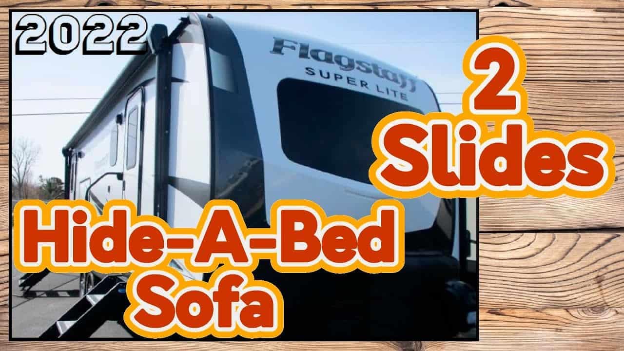 An Flagstaff Super Lite 26RKBS RV trailer with a hide a bed sofa.