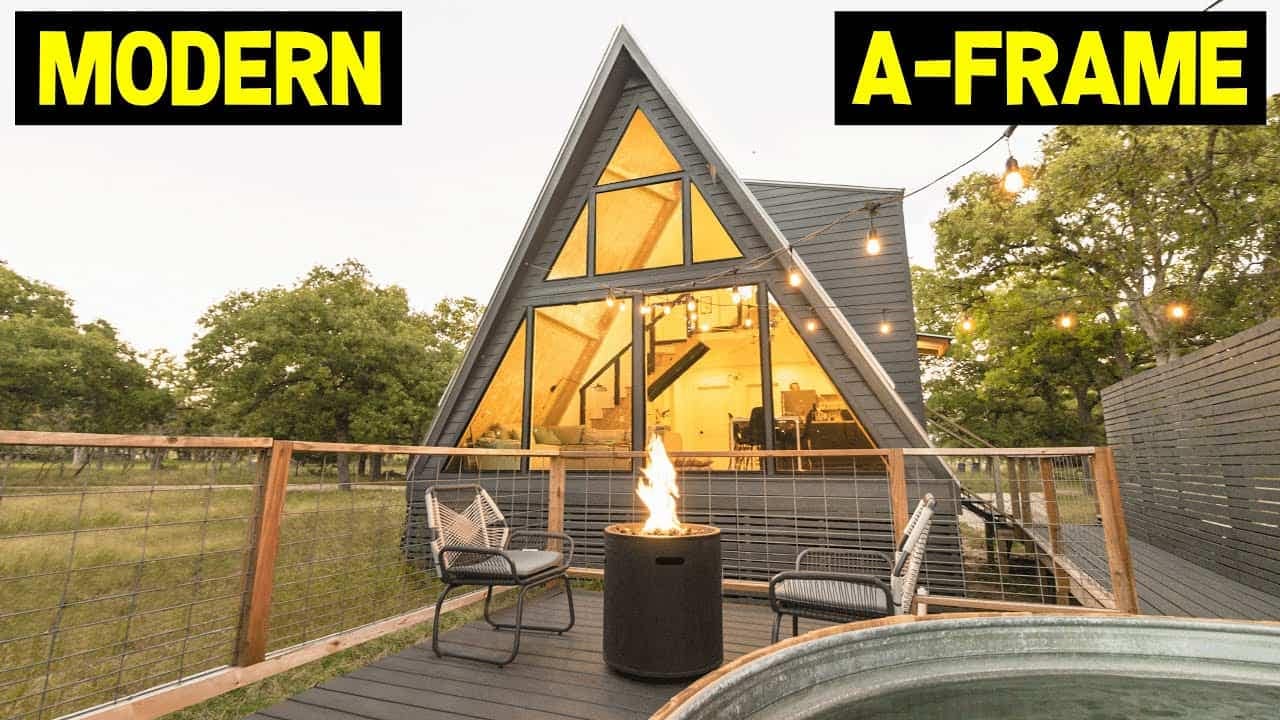 A modern Scandinavian A-Frame Cabin with a fire pit.