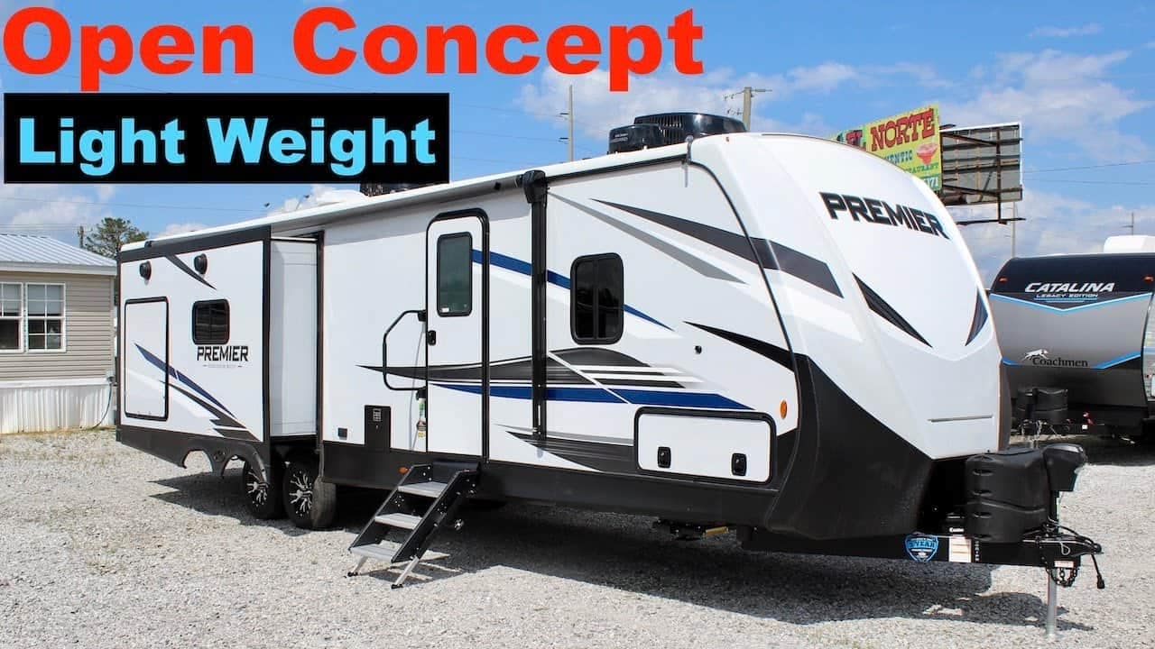 A black and white RV with an open concept and light weight design perfect for couples seeking a travel trailer.