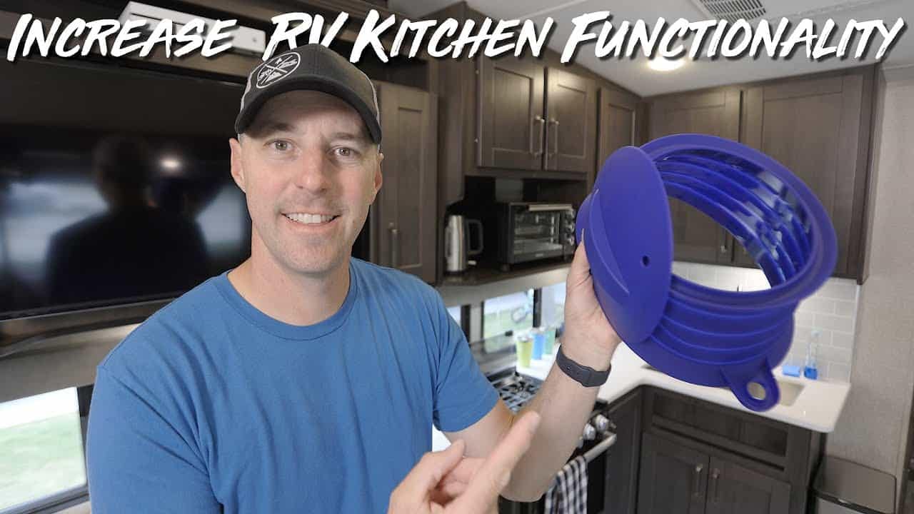 A man is proudly showcasing the incredible functionality of a blue kitchen utensil, demonstrating its suitability for the RV kitchen.