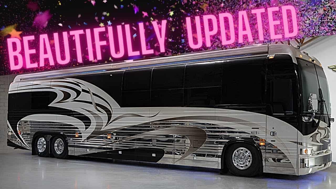 A Totally Updated 2003 Prevost tour bus is parked in a garage.