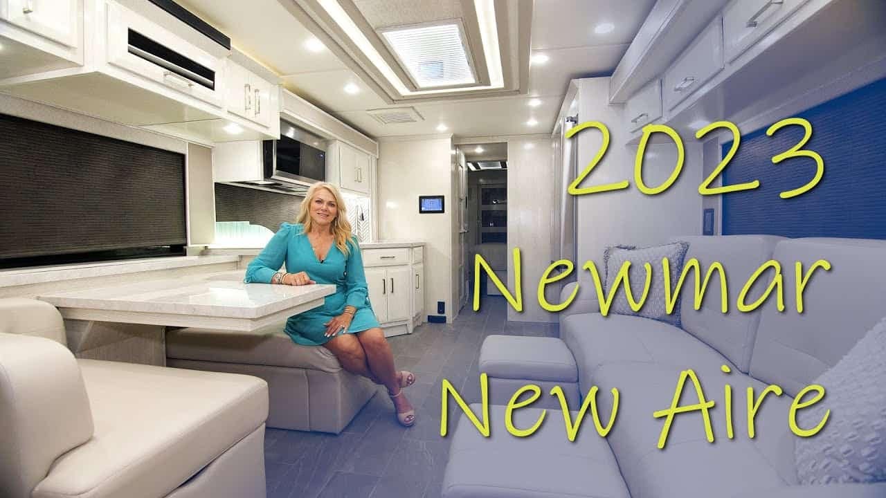A woman is sitting in a 2020 Newmar New Aire RV while taking a tour.