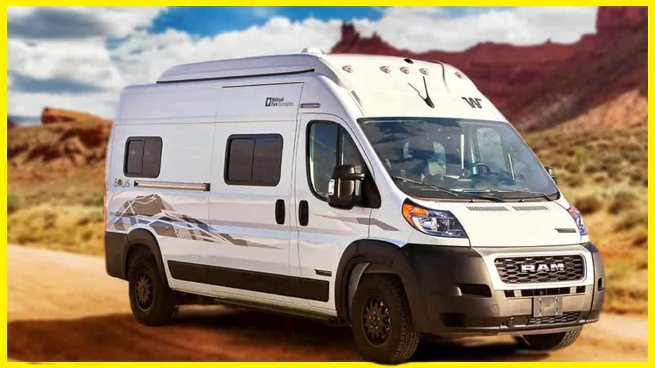 An Exclusive Winnebago Solis is parked on a dirt road.