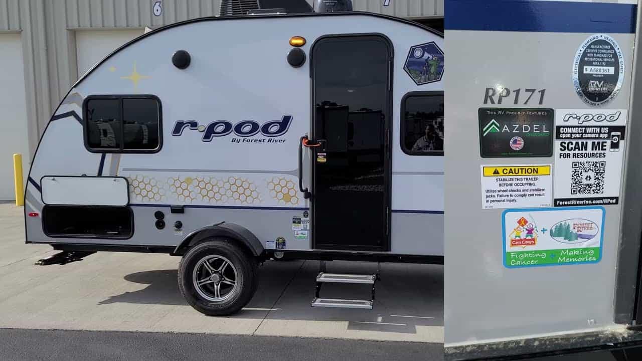 A picture of a small camper with a 2023 R-Pod 171 Travel Trailer sticker on it.