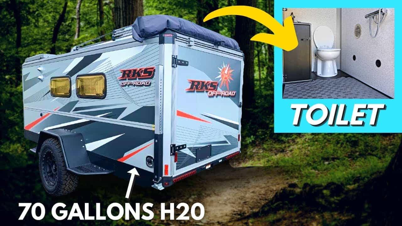 An RKS Off-Road trailer with a toilet in the woods.