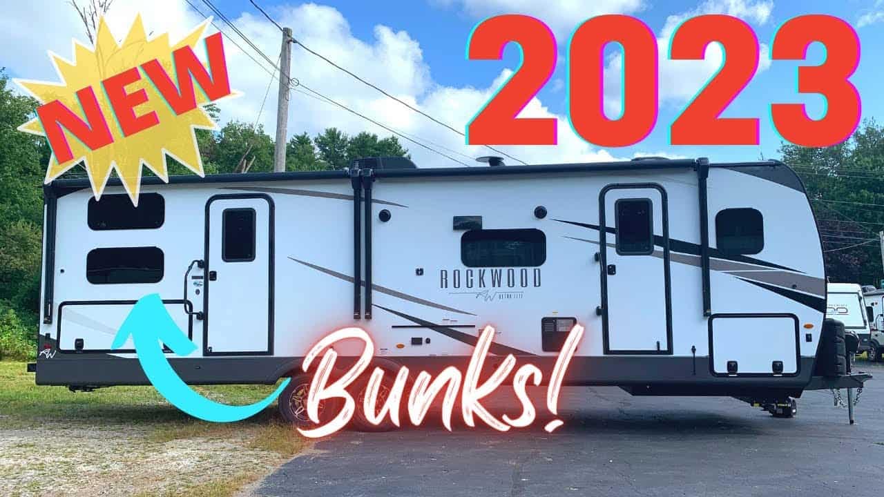 An Ultra Lite Rockwood RV with a new 2706WS RV attached to its side.