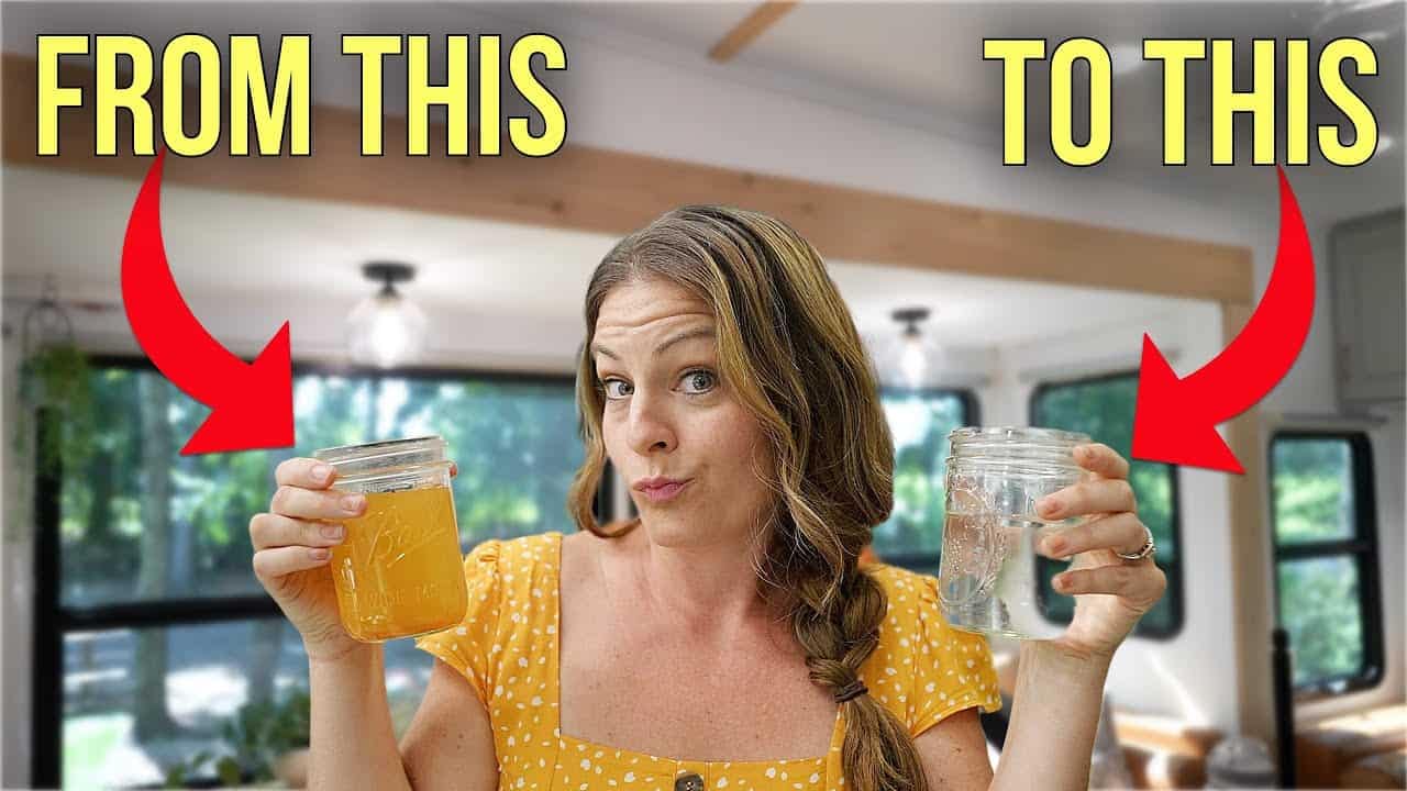 A woman holding up two jars with the words RV to RV.
