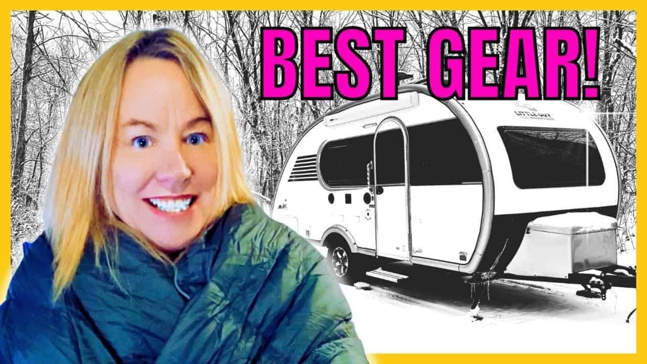 A woman is standing in front of an RV with the words "best gear" for winter camping.