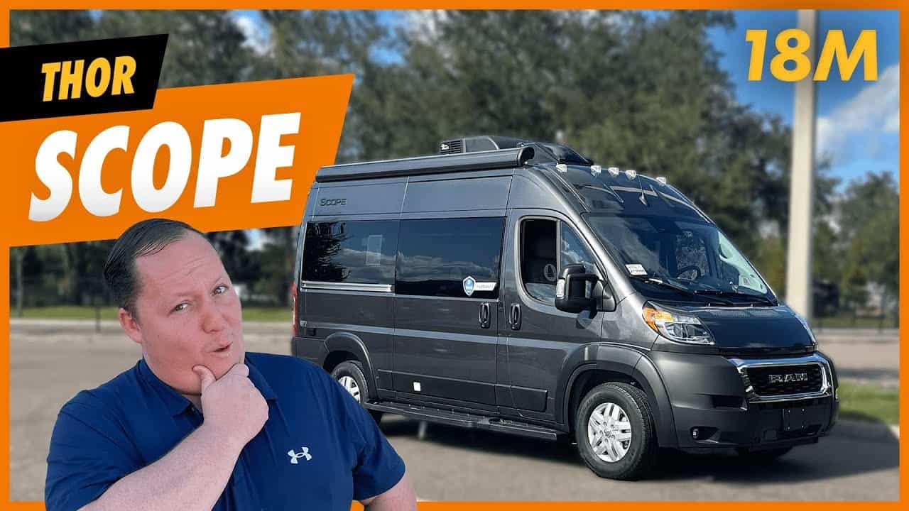 An outdoor enthusiast is standing next to a 2023 Thor Scope 18M, the perfect RV for adventure seekers.
