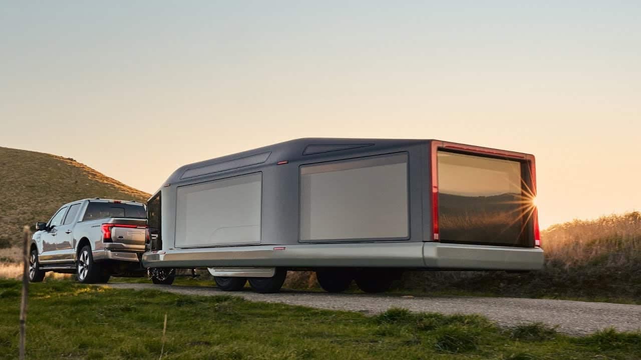 A Lightship truck with a trailer attached to it.
