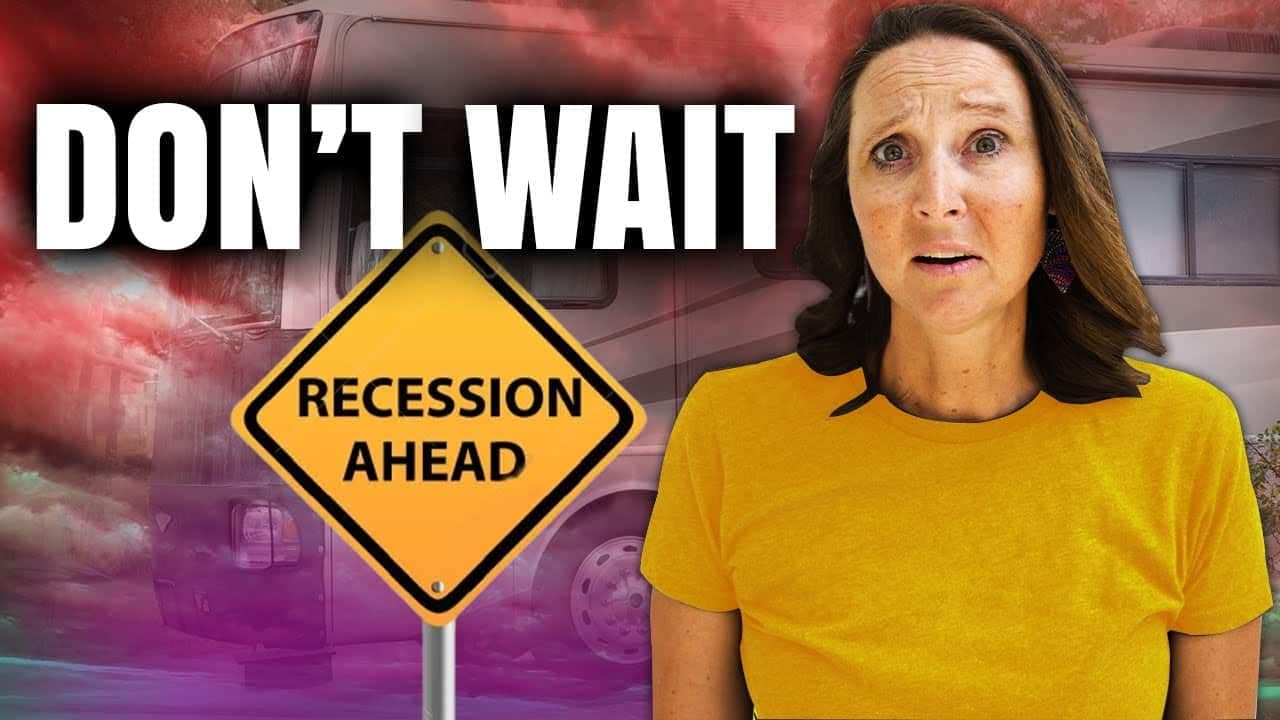 A woman standing next to a sign that says "don't wait" soliciting the time of recession ahead.