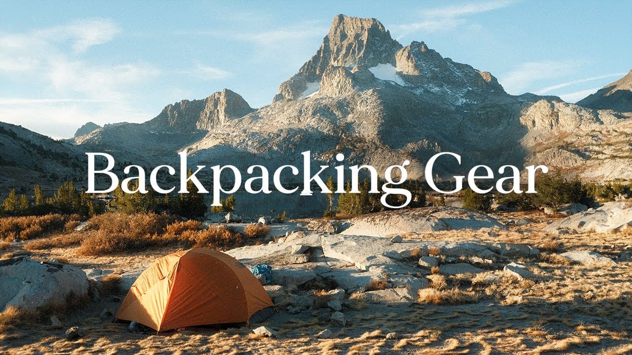 A tent with the words "Backpacking Gear Guide" in the background.