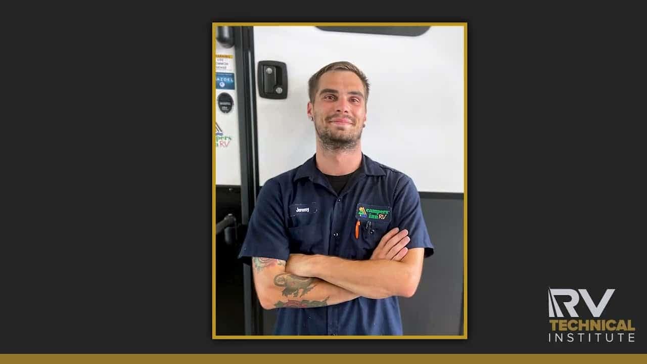 A Technician's Journey captured in an RV dealership, revealing insightful moments of a man with his arms crossed in front of the vehicle.