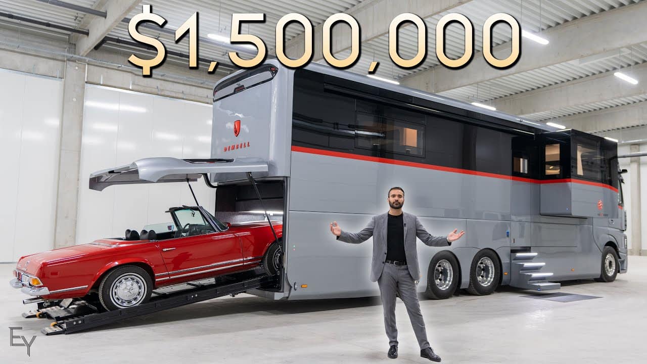 A man is standing next to a futuristic motorhome.