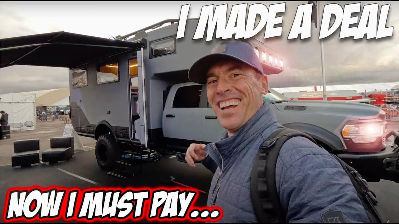 A man is standing in front of an RV with the words "I made a deal now I must pay," contemplating the repercussions of his decision.