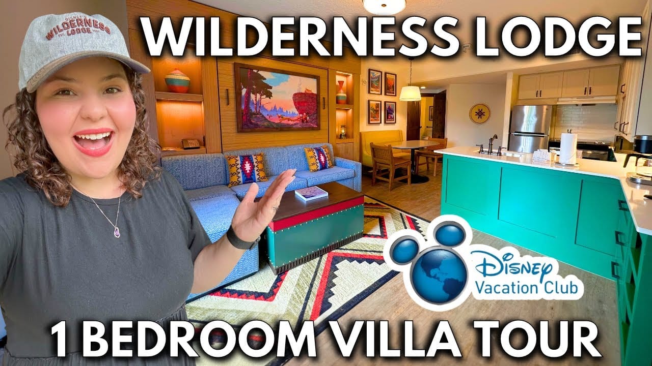 Woman smiling and gesturing towards the interior of a wilderness lodge 1-bedroom villa, with text overlays about the Disney Vacation Club and SEO optimization.