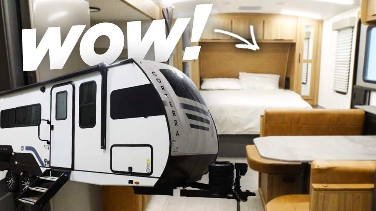 Modern travel trailer interior with comfortable living space highlighted by an exclamation of amazement.