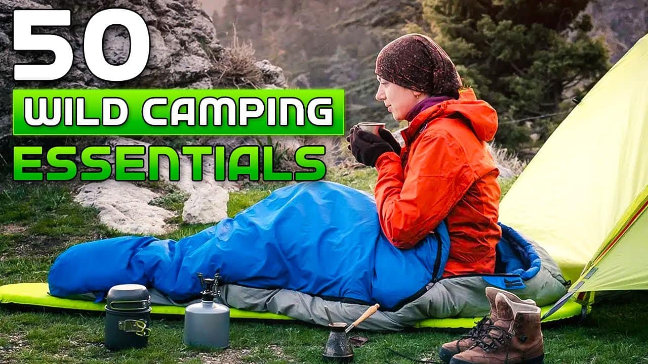 Woman sitting by a tent and sleeping bag holding a mug in a camping setting with text overlay "50 wild camping essentials" Auto Draft.