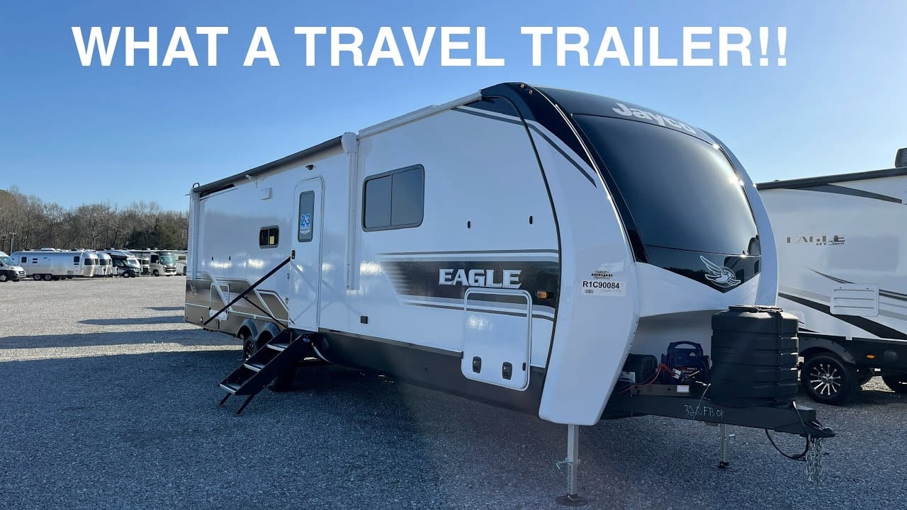 A parked travel trailer with the text "what an amazing travel trailer!!" displayed above.
