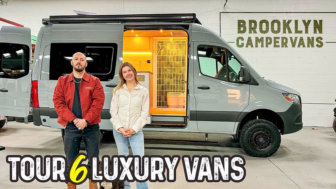 Two people stand in front of a luxury camper van with its door open, showcasing the auto draft interior. The wall behind them displays the text "Brooklyn Campervans." The image promotes a tour of six luxury vans.