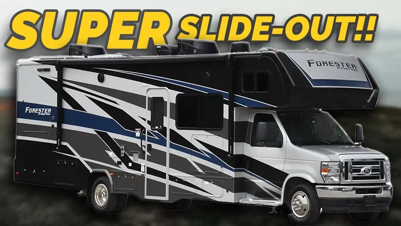 A parked forester rv with an extended slide-out, featuring bold black and blue graphics on a white background, under a cloudy sky is now in Auto Draft mode.