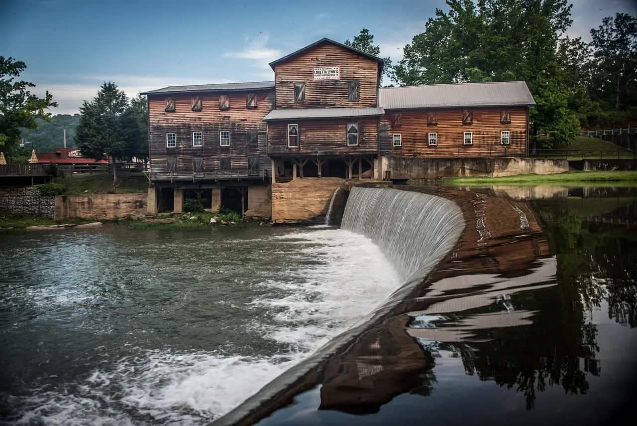 Loretta Lynn's Ranch, an old mill with a waterfall in front of it.