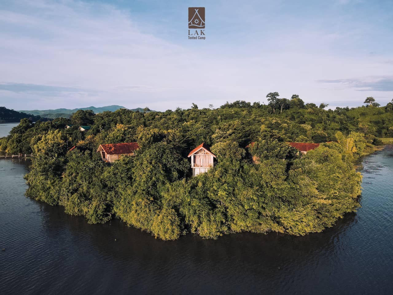 A glamping experience awaits at the Lak Tented Camp, a charming house located on an island in the middle of a serene body of water in the heart of SEA.