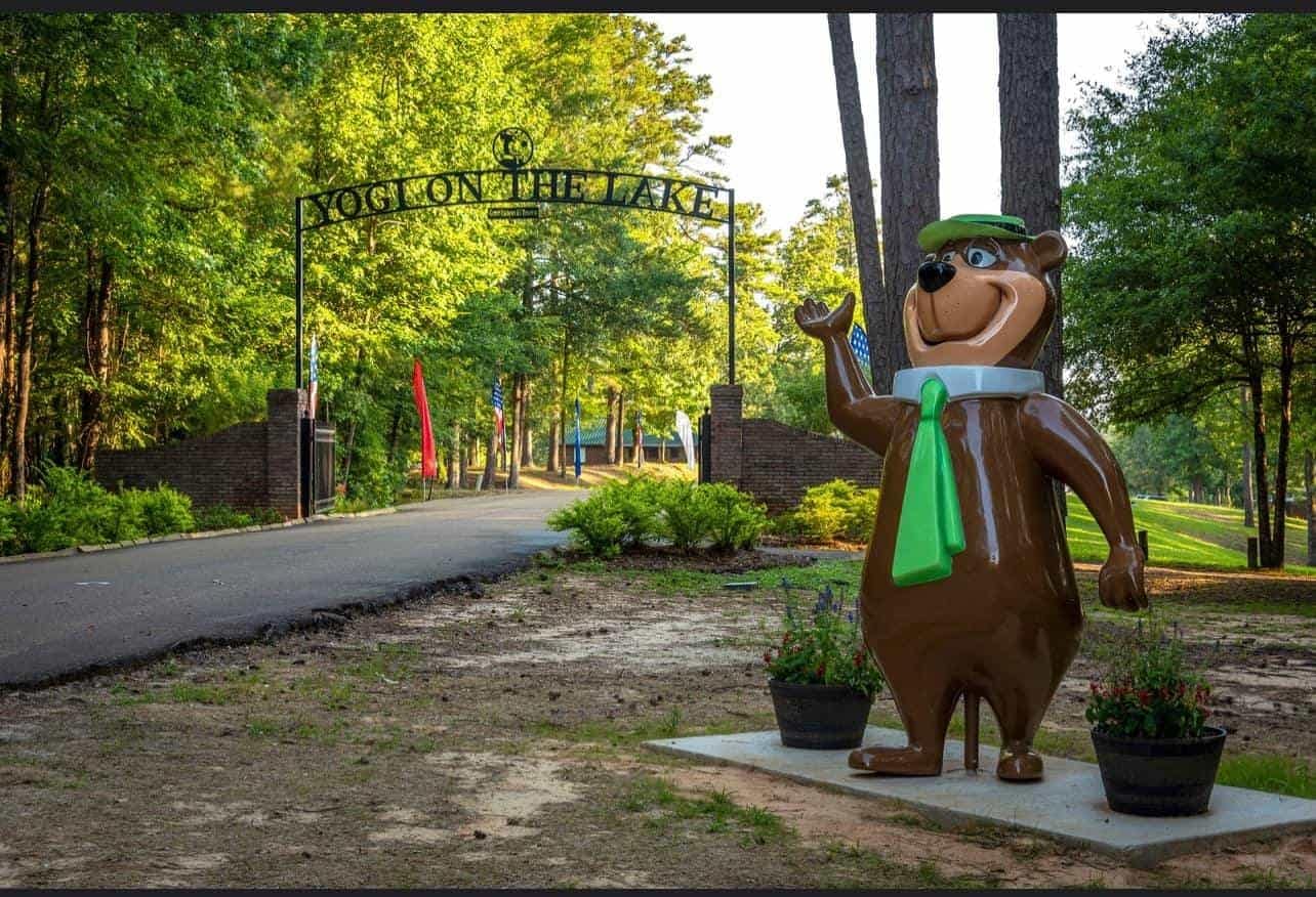A stolen statue of Yogi Bear standing in front of a Mississippi Campground.