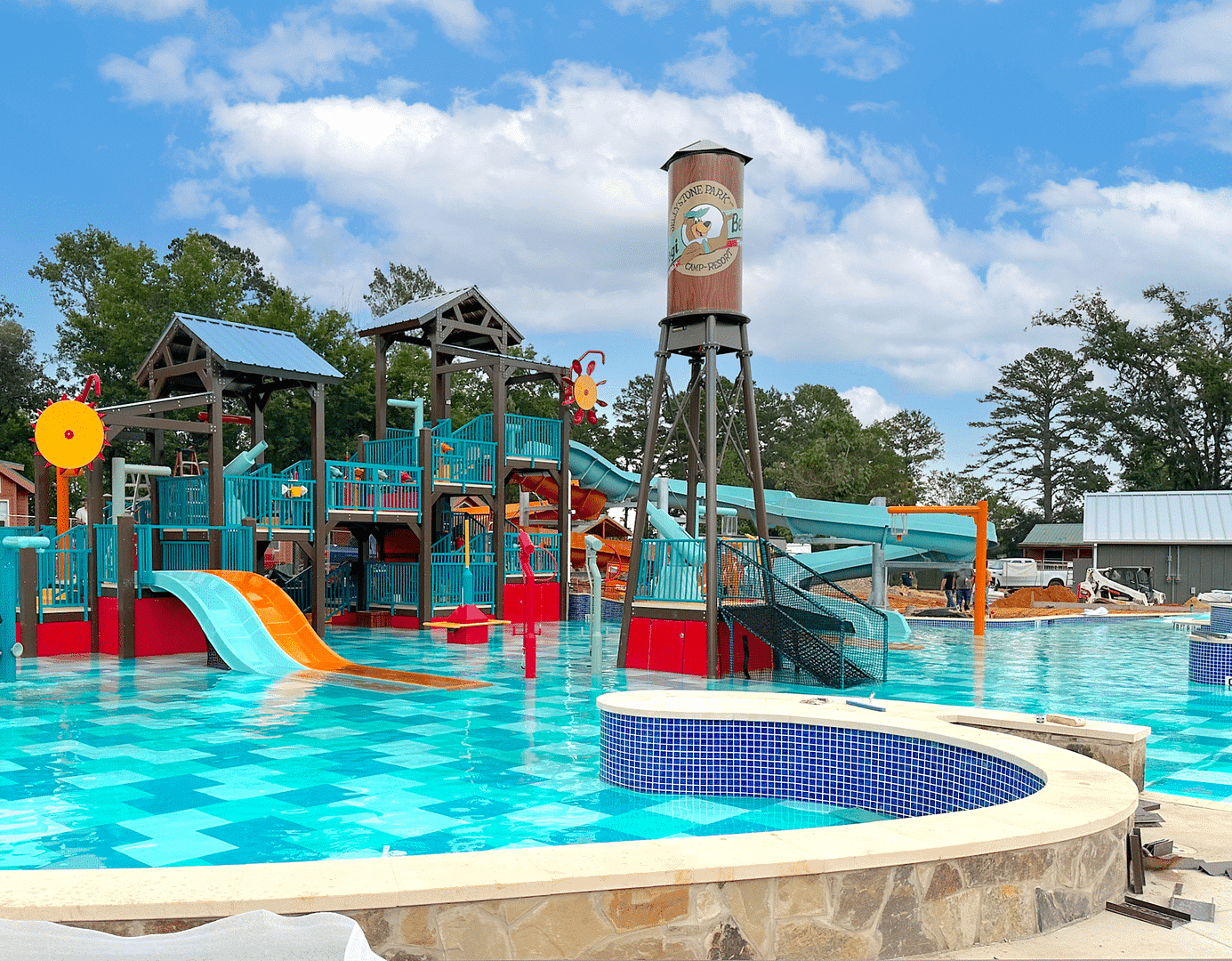Yogi Bear's Jellystone Park in Tyler, Texas offers an exhilarating water park experience with a thrilling slide and various water attractions.