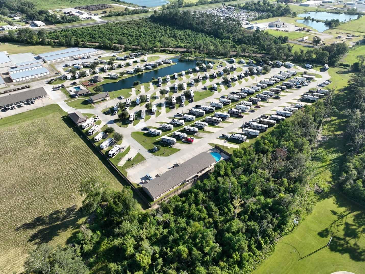 An aerial view of a parking lot and golf course in Beyonder Resort.