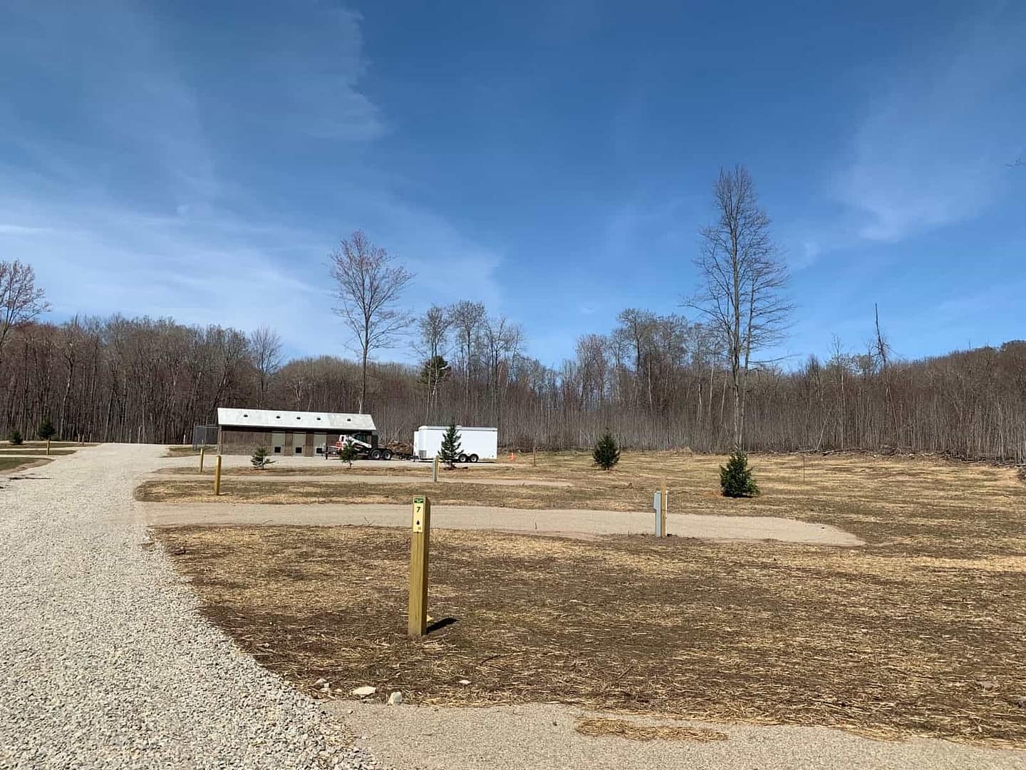 A gravel road in the middle of a wooded area at Reforestation Camp in Brown County.