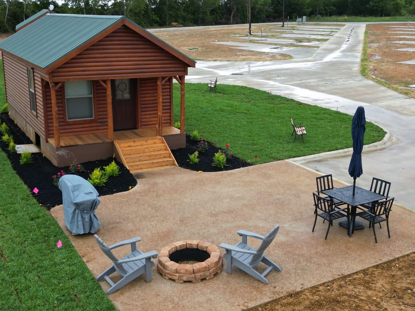 A cozy cabin nestled in the heart of Texas, offering an adventurous escape with a fire pit perfect for roasting s'mores.